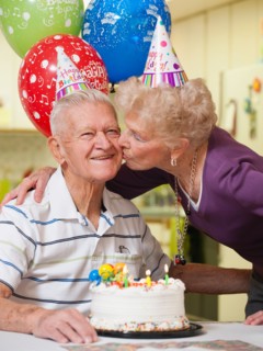 Senior couple celebrating birthday.