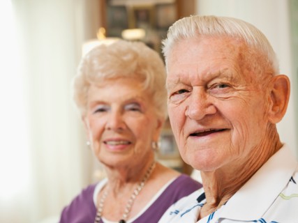 Portrait of senior couple smiling.