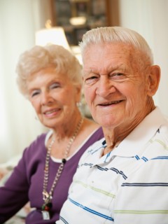 Portrait of senior couple smiling.