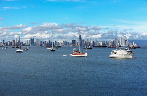 Panama, Panama City, Boats with skyline in background. Photo : DreamPictures