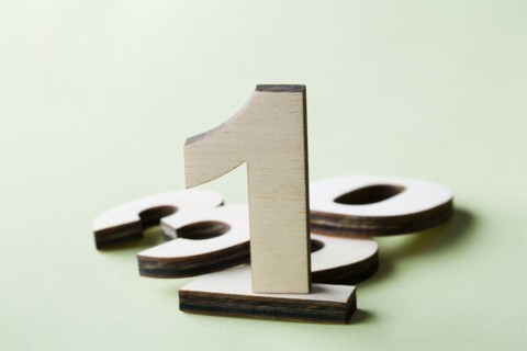 Numbers on white background, studio shot. Photo : Kristin Lee