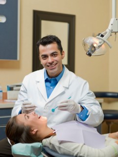 Dentist and patient in dental surgery. Photo : Dan Bannister