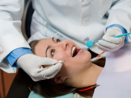 Dentist and patient in dental surgery. Photo : Dan Bannister