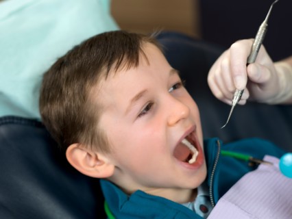 Dentist and patient in dental surgery. Photo : Dan Bannister