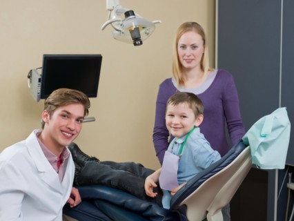 Dentist and patients in dental surgery. Photo : Dan Bannister