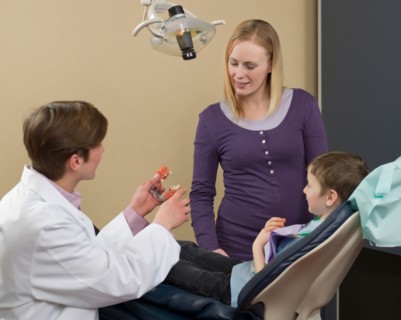 Dentist and patients in dental surgery. Photo : Dan Bannister