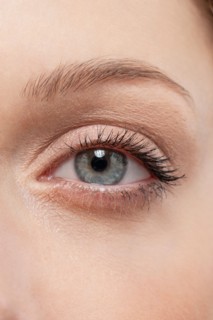 Close up of woman's eye, studio shot. Photo : Jan Scherders