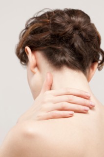 Rear view of beautiful young woman, studio shot. Photo : Jan Scherders