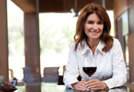 Portrait of woman with glass of wine. Photo : db2stock