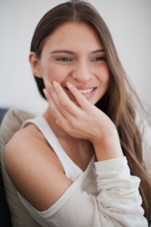 Young woman smiling. Photo : Mark de Leeuw