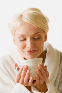 Woman enjoying hot drink. Photo : Rob Lewine
