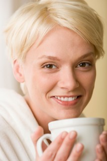 Woman enjoying cup of tea. Photo : Rob Lewine