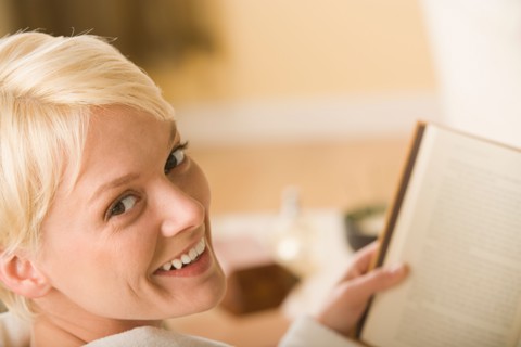 Woman reading book. Photo : Rob Lewine