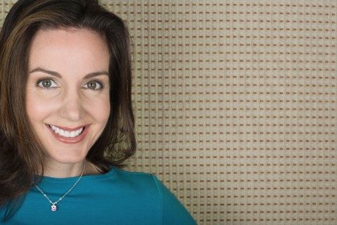 Portrait of smiling woman. Photo : Rob Lewine