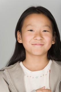 Portrait of smiling teenage girl. Photo : Rob Lewine
