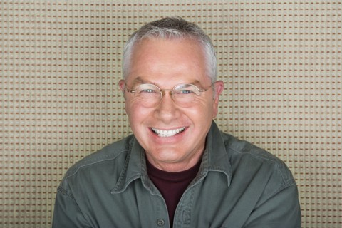 Studio portrait of senior man smiling. Photo : Rob Lewine