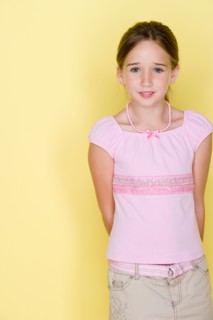 Studio shot portrait of teenage girl, three quarter length. Photo : Rob Lewine