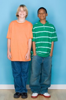 Studio shot portrait of two teenagers, full length. Photo : Rob Lewine