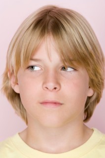 Studio shot portrait of teenage boy looking away, close-up. Photo : Rob Lewine