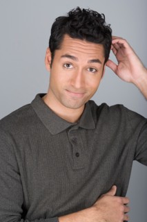 Studio shot portrait of mid adult man scratching head, head and shoulders. Photo : Rob Lewine