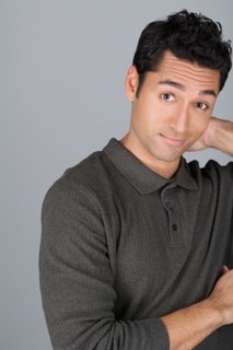 Studio shot portrait of mid adult man, head and shoulders. Photo : Rob Lewine