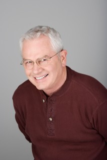 Studio shot portrait of smiling senior man, head and shoulders. Photo : Rob Lewine
