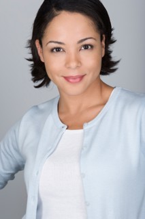 Studio shot portrait of mid adult woman, head and shoulders. Photo : Rob Lewine
