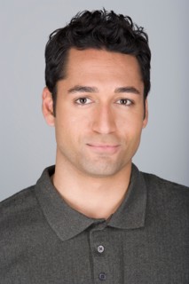 Studio shot portrait of mid adult man, head and shoulders. Photo : Rob Lewine
