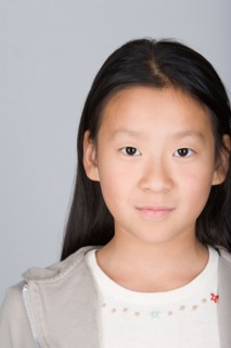 Studio shot portrait of teenage girl, head and shoulders. Photo : Rob Lewine
