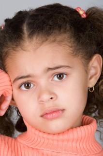 Studio shot portrait of girl, close-up. Photo : Rob Lewine
