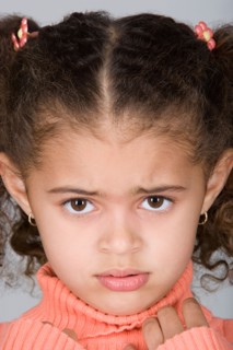 Studio shot portrait of girl, close-up. Photo : Rob Lewine