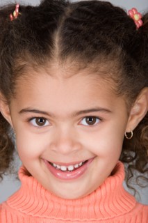 Studio portrait of happy pre-teen girl (10-11). Photo : Rob Lewine