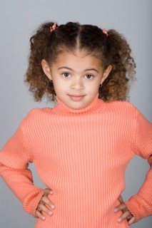 Studio portrait of confident pre-teen girl (10-11). Photo : Rob Lewine