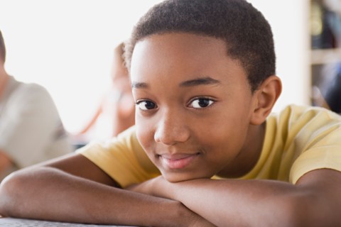 Portrait of boy in classroom. Photo : Rob Lewine