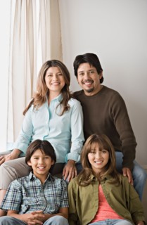 Portrait of smiling family. Photo : Rob Lewine