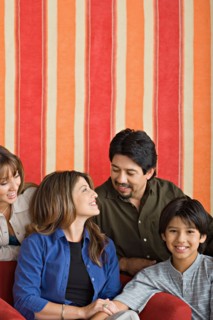 Portrait of smiling family. Photo : Rob Lewine