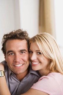 Portrait of smiling couple. Photo : Rob Lewine