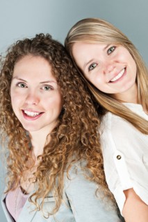Studio portrait of two young women. Photo : Elena Elisseeva