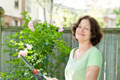 Woman working in garden. Photo : Elena Elisseeva