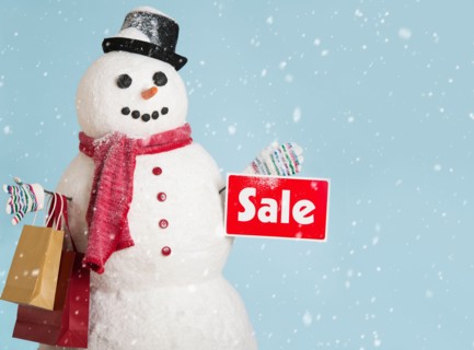 Studio shot of snowman with shoppings.