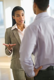 Business man and woman arguing.