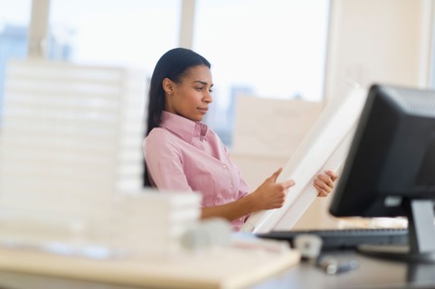 Female architect in office.