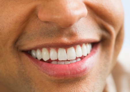 Close-up of man's perfect teeth.