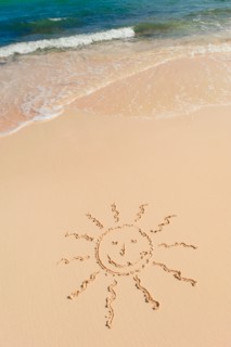 Mexico, Yucatan. Sun drawing on beach.