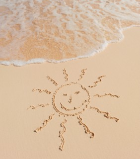 Mexico, Yucatan. Sun drawing on beach.