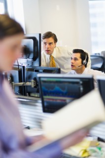 Traders at trading desk.