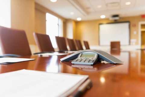 Conference phone on conference table.