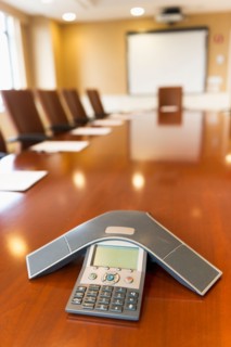 Conference phone on conference table.