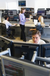 Traders at trading desk.