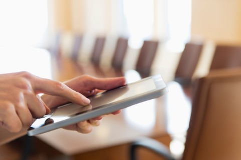Hands of businesswoman using tablet pc.